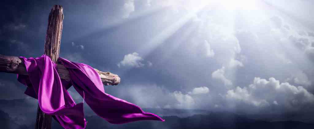 flowing-purple-robe-on-wooden-cross